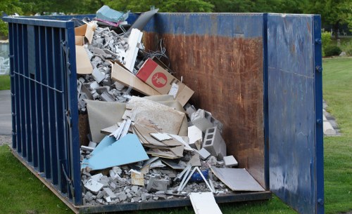 Professionals conducting flat clearance in a residential apartment