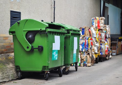 Professional waste removal team handling furniture